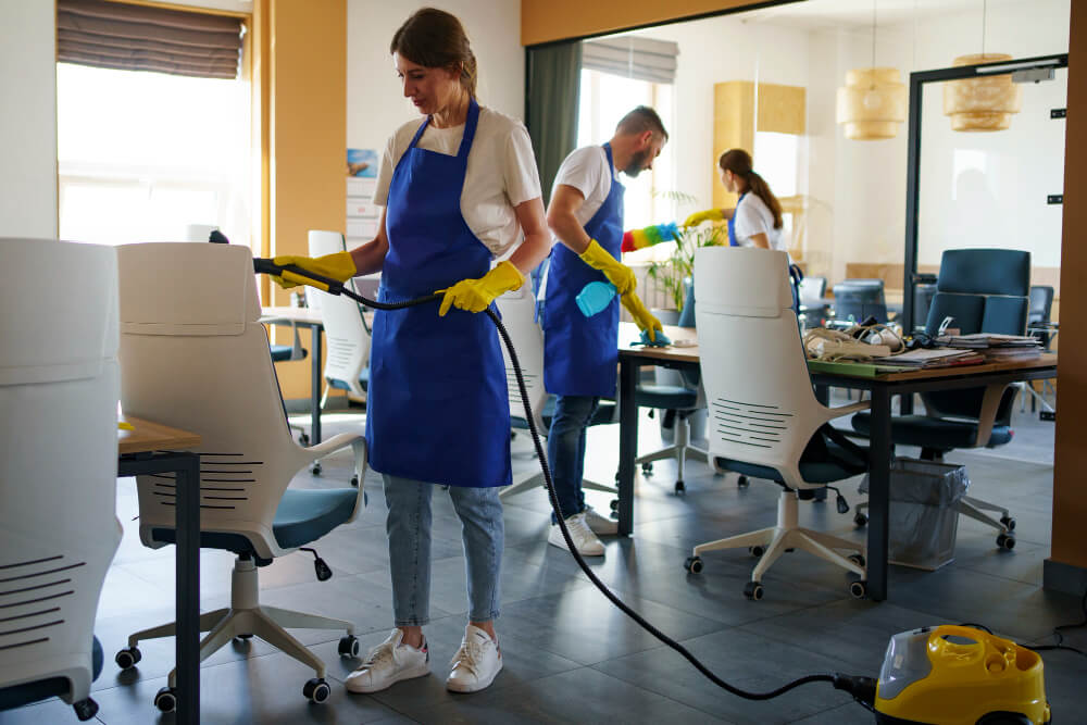 Group of cleaners deep cleaning an office.